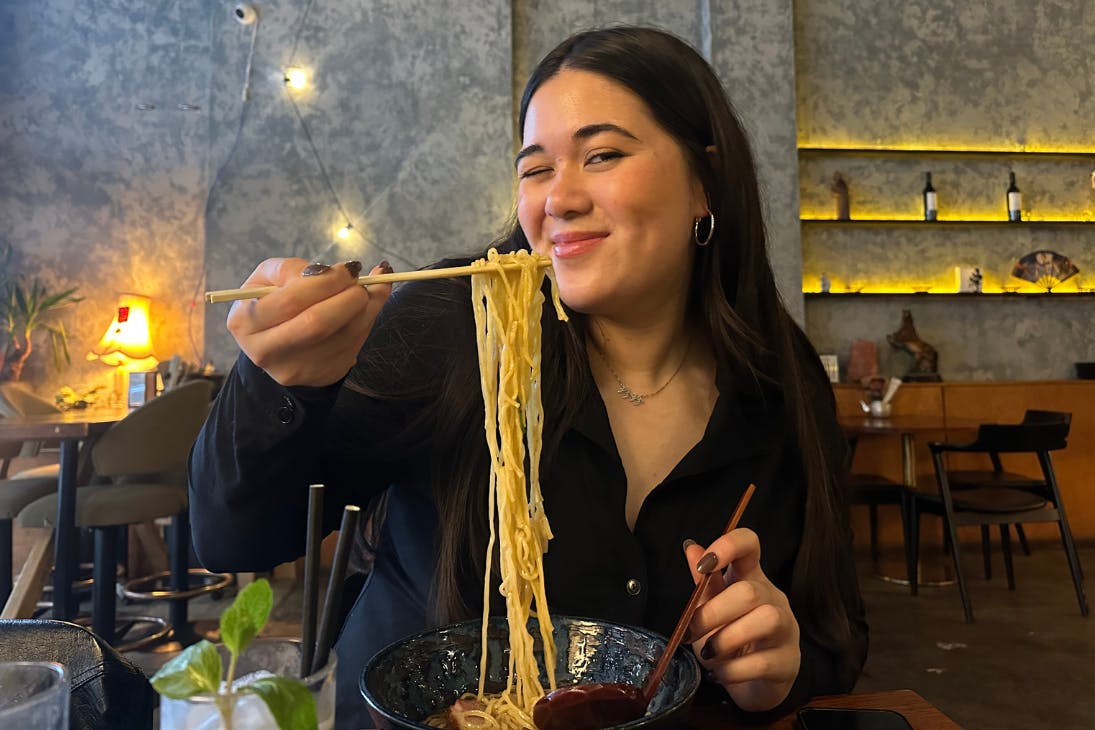 Woman eating ramen